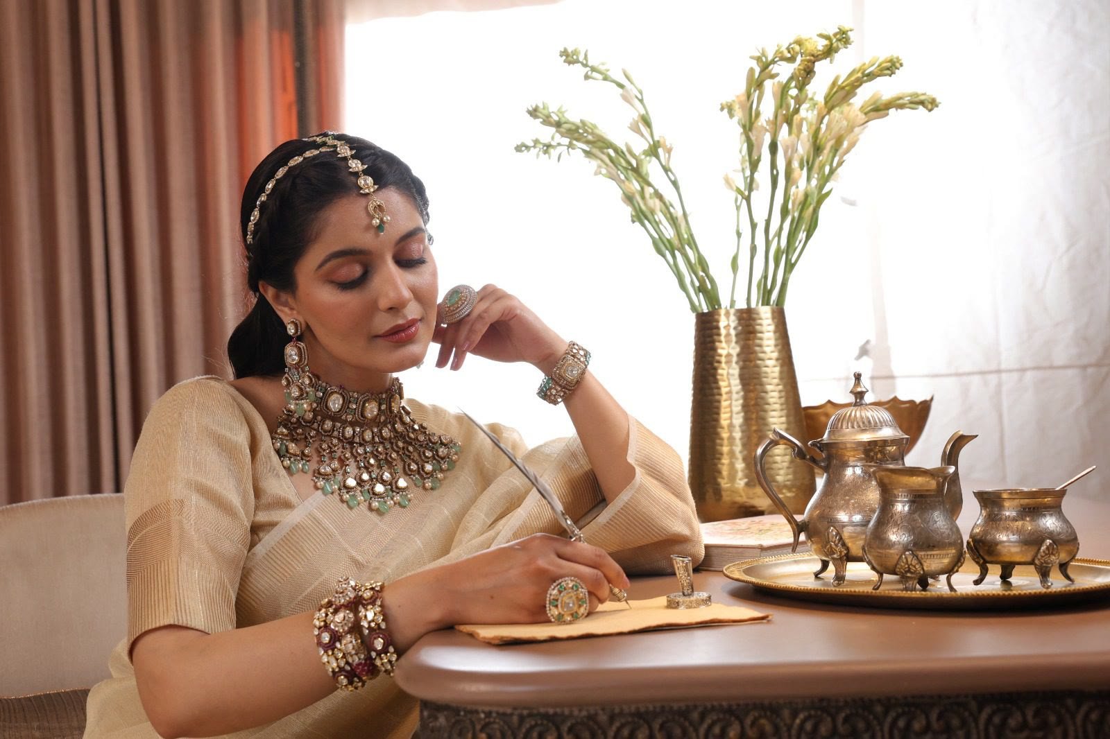 A woman in fine Rayu jewellery in a warm Jaipur lifestyle setting